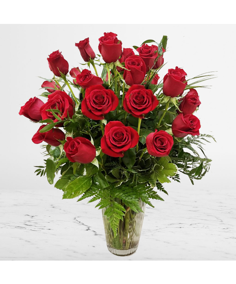 One dozen red roses in glass vase