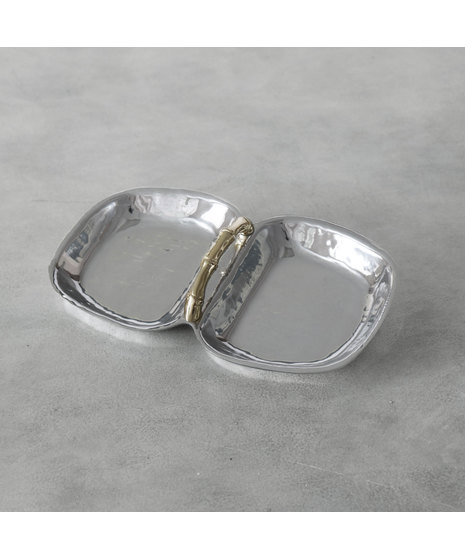 silver serving tray with gold-toned bamboo handle