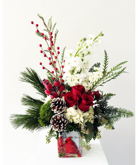 holiday flowers with red roses, pine cones, and more
