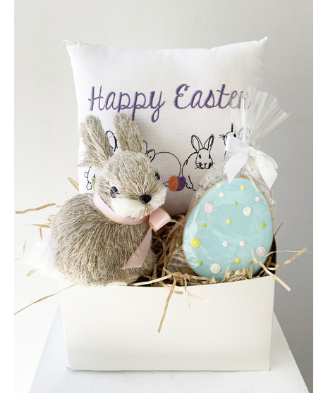 easter basket with cookie, bunny, and decorative pillow