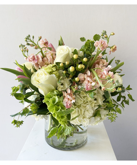 peaches and green floral arrangement