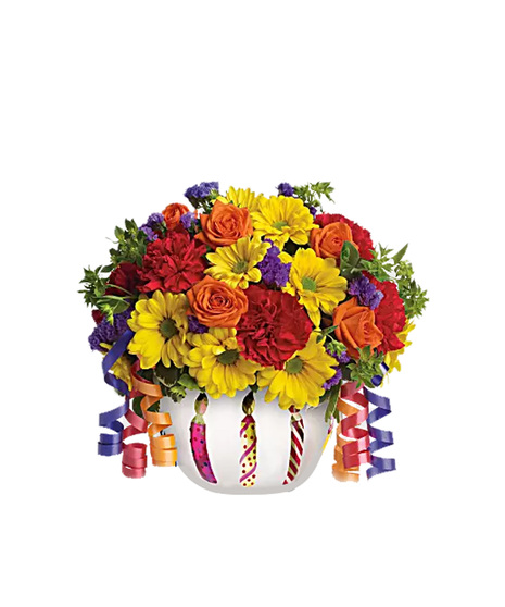 Yellow daisy chrysanthemums, purple status, orange mini roses and red carnations in a cheerful birthday container.